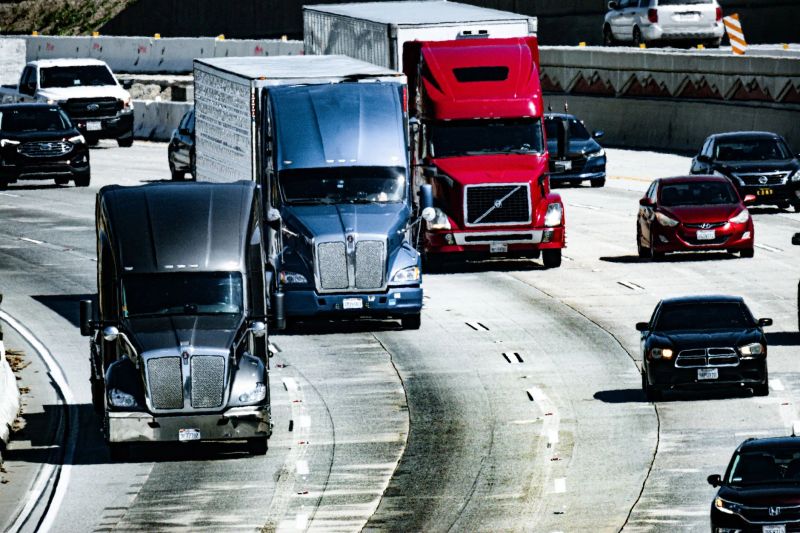 Sagacity Towing truck navigating downtown Denver traffic