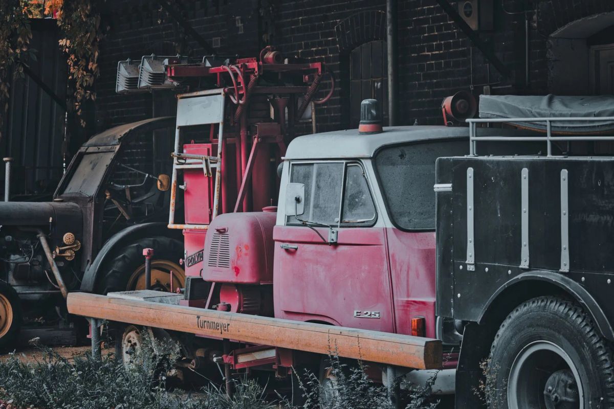 Sagacity Towing truck assisting a driver at night in Denver's RiNo district