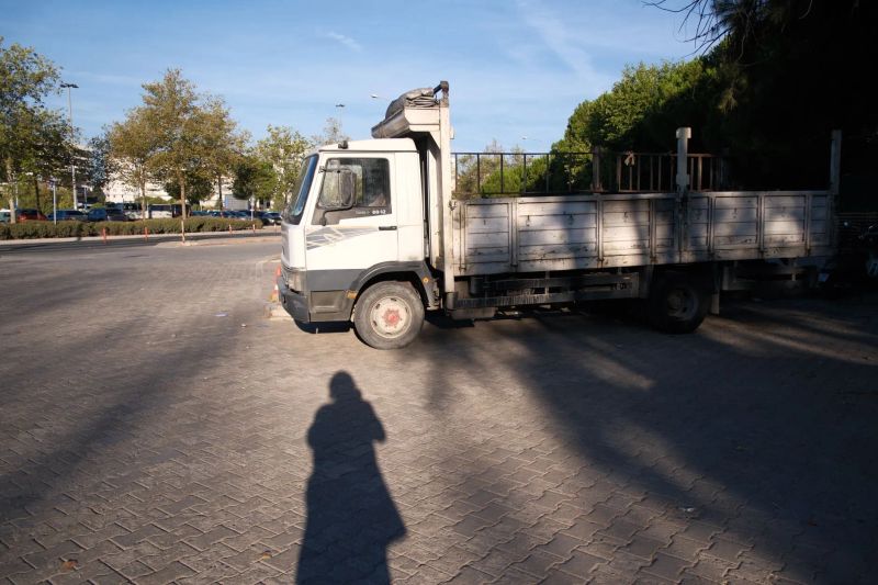 Tow truck loading a disabled sedan for Sagacity Towing